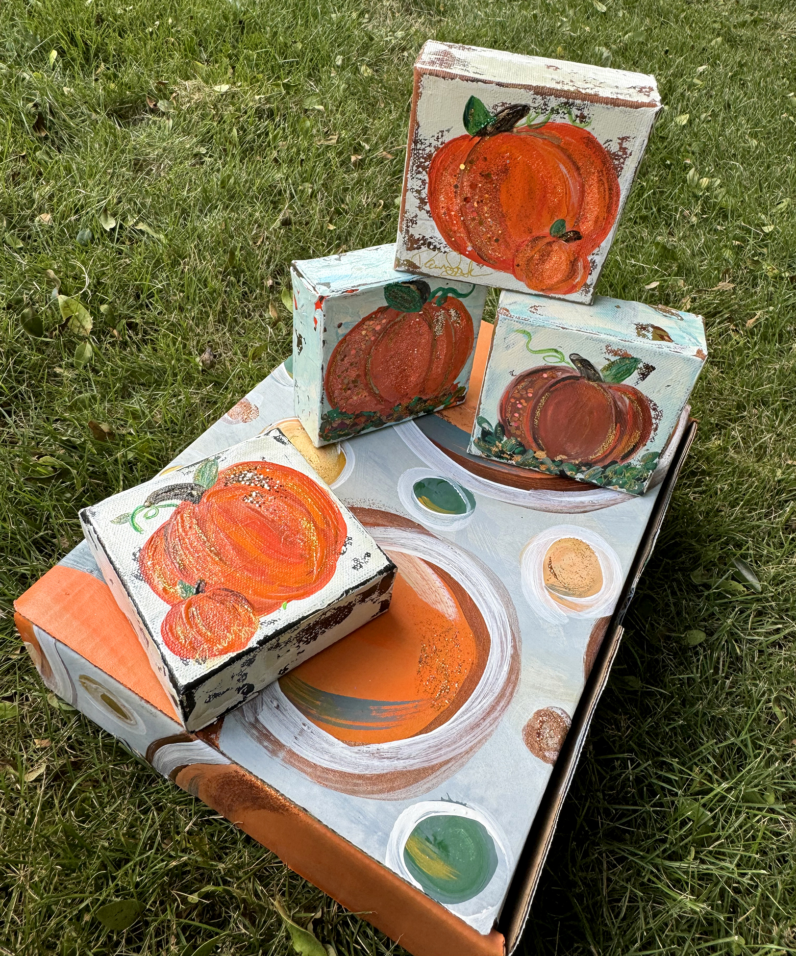 Set of 4 pumpkins outside