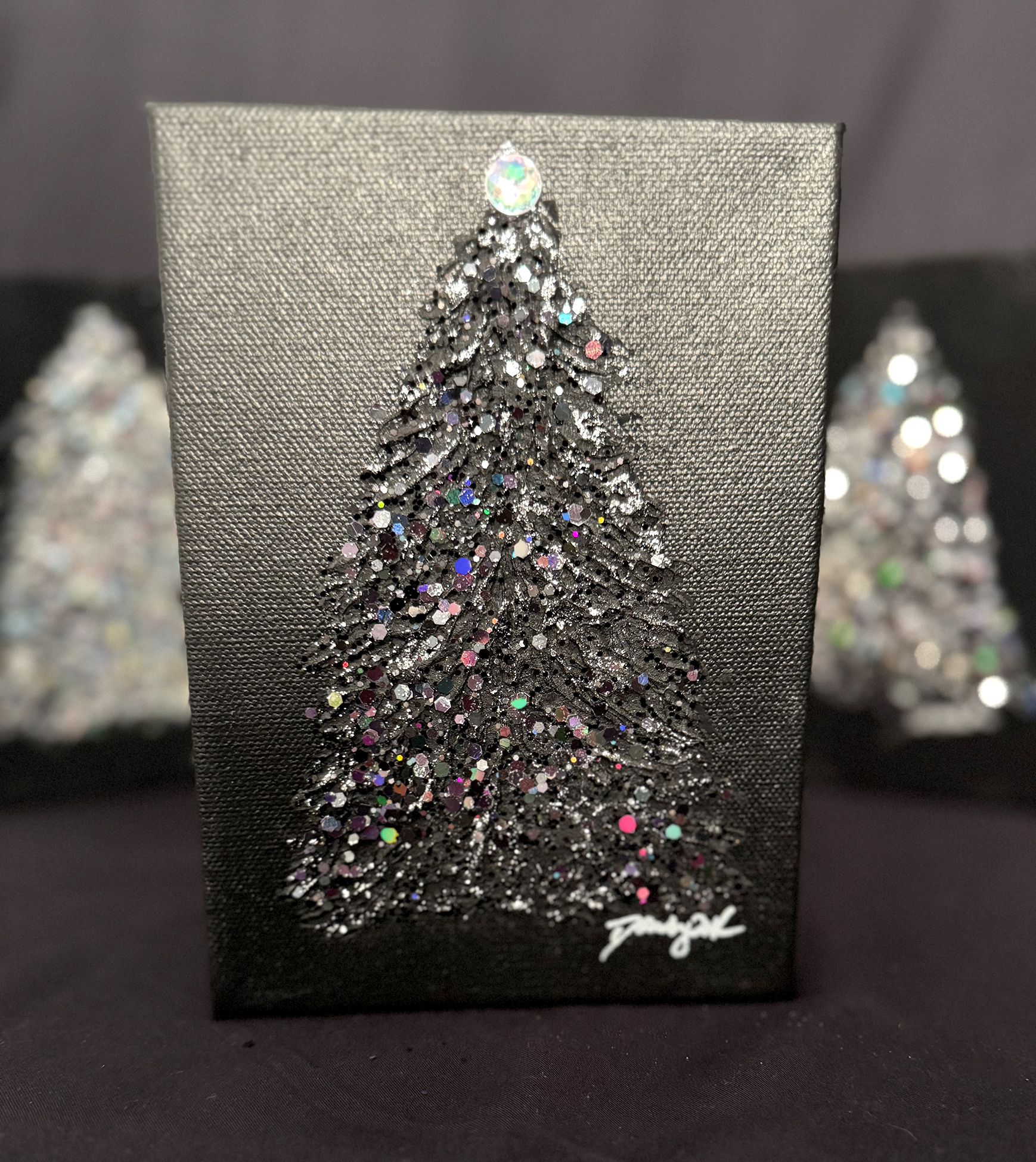 Black Christmas trees on canvas, ©Dawn South